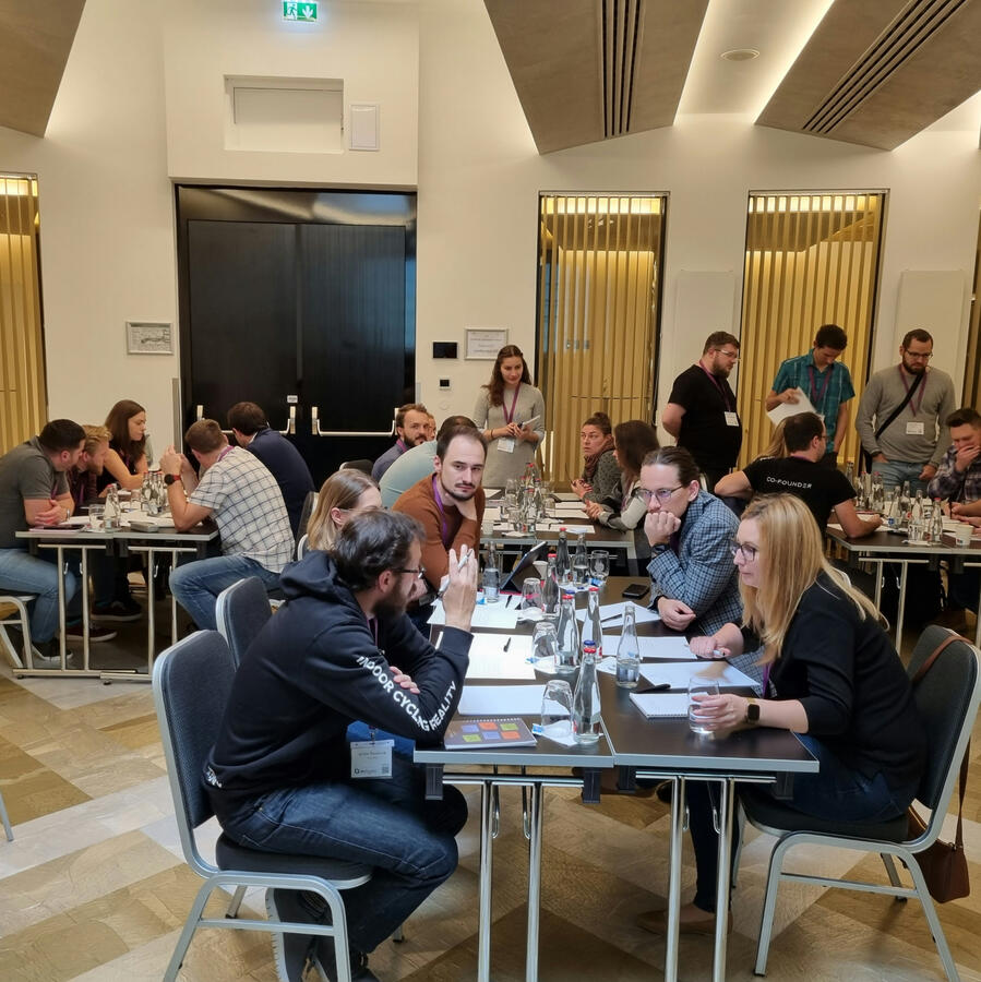People at tables at a workshop